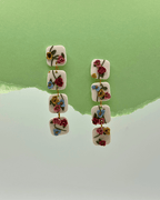 Pendientes Láquesis